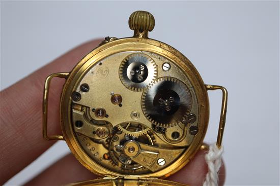 A gentlemans early 20th century 18ct gold manual wind wrist watch, with Roman dial and case back inscription,